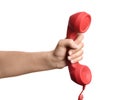 Woman holding red corded telephone handset on white background, closeup. Hotline concept Royalty Free Stock Photo