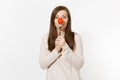 Woman holding red fresh tomato on fork in front nose like clown isolated on white background. Proper nutrition