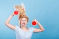 Woman holding red grapefruit having crazy windblown hair Royalty Free Stock Photo