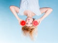 Woman holding red grapefruit having crazy windblown hair Royalty Free Stock Photo