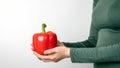 Woman holding red, sweet pepper or paprika. Health and healthy lifesyle concept