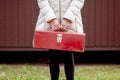 Woman holding a red  vintage suitcase Royalty Free Stock Photo