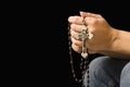 Woman holding rosary. Royalty Free Stock Photo