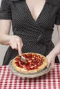 Woman holding round strawberry cake Royalty Free Stock Photo