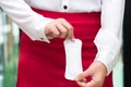 Woman holding sanitary napkins with red skirt - woman on her per Royalty Free Stock Photo