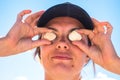 Woman holding seashells near her eyes Royalty Free Stock Photo