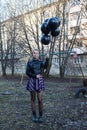 woman holding several balloons