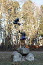 woman holding several balloons