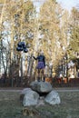 woman holding several balloons