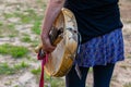 Woman holding shamanic frame drum