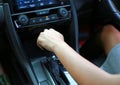 Woman holding shift lever handle focus on hand