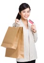 Woman holding shopping bag with credit card Royalty Free Stock Photo