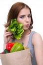 Woman holding a shopping bag full of groceries Royalty Free Stock Photo