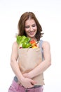 Woman holding a shopping bag full of groceries Royalty Free Stock Photo