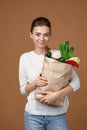 Woman holding a shopping bag full of groceries Royalty Free Stock Photo