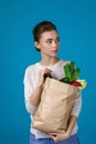 Woman holding a shopping bag full of groceries Royalty Free Stock Photo
