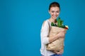 Woman holding a shopping bag full of groceries Royalty Free Stock Photo