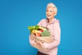 Woman holding shopping bag with healthy food Royalty Free Stock Photo