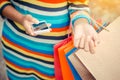 Woman holding shopping bag after shop in the mall