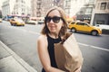 Woman holding shopping bag in Soho, Manhattan, New York