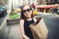 Woman holding shopping bag in Soho, Manhattan, New York