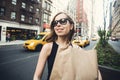 Woman holding shopping bag in Soho, Manhattan, New York