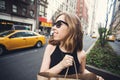 Woman holding shopping bag in Soho, Manhattan, New York