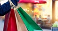 Woman holding shopping bags in hand on mall background Royalty Free Stock Photo