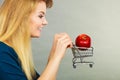 Woman holding shopping cart with apple inside Royalty Free Stock Photo