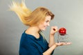 Woman holding shopping cart with apple inside Royalty Free Stock Photo