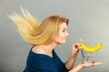 Woman holding shopping cart with banana inside Royalty Free Stock Photo