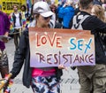 2019: Woman holding a sign `Love, Sex, resistance` attending the Gay Pride parade also known as Christopher Street DayCSD,Munich