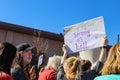 Woman holding sign that says Strong as Hell in Womens March in Tulsa Oklahoma USA 1-20-2018