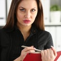 Woman holding silver pen ready to make Royalty Free Stock Photo