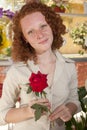 Woman holding a single rose