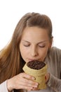 Woman holding a small bag of coffee beans Royalty Free Stock Photo