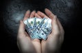 Woman holding small dollar in hands. Economical crisis in the USA. Currency devaluation and inflation Royalty Free Stock Photo