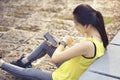 Woman holding smart phone connect listen music to earphone, wearable fitness device. Female runner looking heart rate watch on Royalty Free Stock Photo