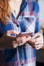 Woman holding smart phone in hands Royalty Free Stock Photo