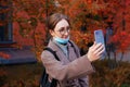 Woman holding smartphone in front of her during video call. Communication with relatives during coronavirus pandemic