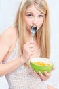 Woman holding spoon and corn flakes Royalty Free Stock Photo
