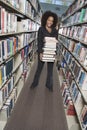 Woman Holding Stack Of Books