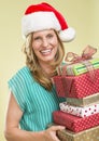 Woman Holding Stack Of Christmas Presents Royalty Free Stock Photo