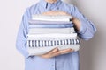 Woman holding stack of clean bed linens on white background, closeup Royalty Free Stock Photo