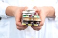 Woman holding a stack of pills blisters