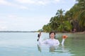 Woman holding the starfish and diving mask Royalty Free Stock Photo