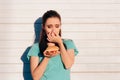 Woman Holding a Stinky and Disgusting Burger