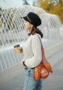 Woman holding a string bag and paper cup of coffee Royalty Free Stock Photo