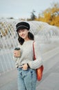 Woman holding a string bag and paper cup of coffee Royalty Free Stock Photo