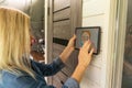 woman holding a tablet computer with system clever house on a screen on the background of the house Royalty Free Stock Photo